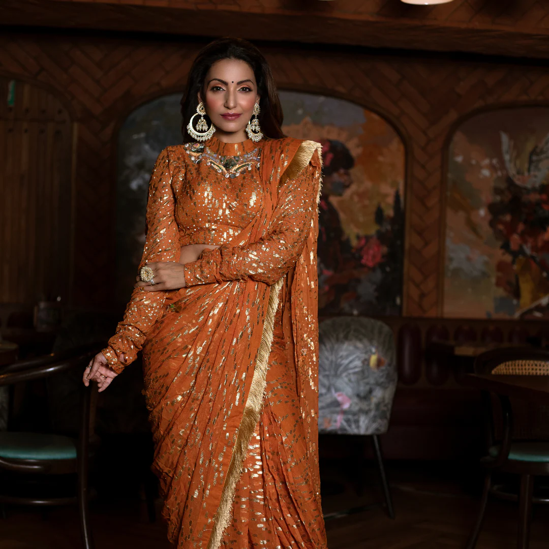 Navina Bole burnt orange drape saree